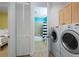 Bathroom and laundry area featuring modern washer and dryer for added convenience at 3334 Purple Martin Dr # 214, Punta Gorda, FL 33950