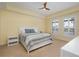 Inviting bedroom with carpet flooring, natural light, and neutral decor at 3334 Purple Martin Dr # 214, Punta Gorda, FL 33950