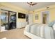 Sunlit bedroom featuring a sliding glass door to the balcony and ensuite bathroom at 3334 Purple Martin Dr # 214, Punta Gorda, FL 33950