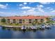 Waterfront condo featuring boat slips, lush landscaping, and stunning views at 3334 Purple Martin Dr # 214, Punta Gorda, FL 33950