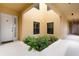 Exterior of the home showcases a well-maintained walkway with tasteful landscaping and neutral colored stucco at 3334 Purple Martin Dr # 214, Punta Gorda, FL 33950