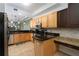 Bright kitchen featuring granite counters, stainless appliances, and a breakfast bar at 3334 Purple Martin Dr # 214, Punta Gorda, FL 33950
