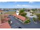 Aerial view showing covered parking with nearby waterways and lush greenery in the surrounding community at 3334 Purple Martin Dr # 214, Punta Gorda, FL 33950