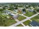 A charming single-story home with a spacious yard sits in a quiet neighborhood with mature trees and well-maintained landscaping at 3561 Middletown St, Port Charlotte, FL 33952