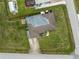 Aerial view of the home, showcasing the backyard, roof, and driveway at 3561 Middletown St, Port Charlotte, FL 33952