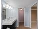 Bathroom featuring a double vanity with dark cabinets at 3561 Middletown St, Port Charlotte, FL 33952