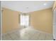 Sunny bedroom offering ample space, neutral tones, tile floors, and a closet with bright, natural light at 3561 Middletown St, Port Charlotte, FL 33952