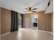 Bedroom featuring tile floors, a ceiling fan, and sliding glass door at 3561 Middletown St, Port Charlotte, FL 33952