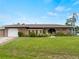 Well-maintained home features a garage, walkway, and landscaped front yard at 3561 Middletown St, Port Charlotte, FL 33952