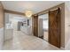 Spacious kitchen flows into the living area through sliding barn doors, offering a modern and open layout at 3561 Middletown St, Port Charlotte, FL 33952