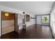Spacious living room featuring wood floors and neutral walls, desk, and a decorative barn door detail at 3561 Middletown St, Port Charlotte, FL 33952