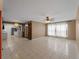 Open concept living room and kitchen featuring tile flooring and natural light at 3561 Middletown St, Port Charlotte, FL 33952