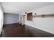 Well lit living room with wood floors, grey accent walls, shiplap and barn door detail, and a built-in desk at 3561 Middletown St, Port Charlotte, FL 33952