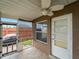A cozy patio with a ceiling fan, an enclosed screen, and a view of the backyard at 3561 Middletown St, Port Charlotte, FL 33952