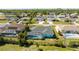 Aerial view showing the screened pool area and the surrounding neighborhood at 4260 Kessler Ter, North Port, FL 34287