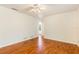 Comfortable bedroom features wood floors and ample natural light at 4260 Kessler Ter, North Port, FL 34287