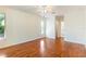 Bright bedroom featuring hardwood floors, natural light, and a ceiling fan at 4260 Kessler Ter, North Port, FL 34287