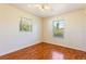 Bright bedroom featuring hardwood floors and natural light at 4260 Kessler Ter, North Port, FL 34287