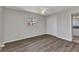 Bright bedroom featuring wood floors, neutral walls, a window, and a closet at 428 Briarwood Rd, Venice, FL 34293