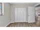 Spacious bedroom featuring new laminate floors, fresh paint, and ample closet space at 428 Briarwood Rd, Venice, FL 34293