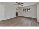 Spacious bedroom with laminate floors, neutral walls, ceiling fan, and natural light at 428 Briarwood Rd, Venice, FL 34293