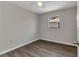 Bright bedroom with ceiling fan and new laminate flooring for a modern touch at 428 Briarwood Rd, Venice, FL 34293