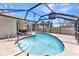 An enclosed in-ground pool surrounded by dark framing, a fence, and backyard at 428 Briarwood Rd, Venice, FL 34293