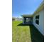 Screened patio with an exterior view of the backyard, siding, and a corner of the house at 4336 Blackman St, North Port, FL 34291