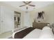 Bright bedroom with a ceiling fan, closet, and elegant decor at 4336 Blackman St, North Port, FL 34291