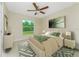 Bedroom with a large window overlooking the lush yard at 4336 Blackman St, North Port, FL 34291