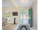 Welcoming foyer with tile flooring, a decorative rug, and an open view of the living spaces at 4461 La France Ave, North Port, FL 34286