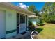 Beautiful view of the side of this single-story home from the driveway, featuring a screened entry at 4461 La France Ave, North Port, FL 34286