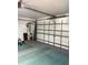 View of garage showing an open door and some equipment; roomy for vehicles at 4461 La France Ave, North Port, FL 34286