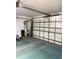 The home's garage with an automatic door and ample room for parking and storage at 4461 La France Ave, North Port, FL 34286
