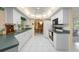 Functional kitchen with white cabinets, ample counter space, and modern appliances, perfect for cooking at 4461 La France Ave, North Port, FL 34286
