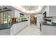 Well-lit kitchen featuring white appliances, and ample counter space at 4461 La France Ave, North Port, FL 34286