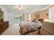 Comfortable main bedroom featuring direct access to a porch with an outside view at 4461 La France Ave, North Port, FL 34286
