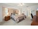 Main bedroom featuring a neutral color scheme, including a desk and a comfortable sitting chair at 4461 La France Ave, North Port, FL 34286