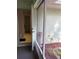 Screened porch leading to backyard with access to bathroom. Includes small garden at 4461 La France Ave, North Port, FL 34286