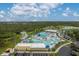 Aerial view of the community waterpark featuring swimming pools, slides, and recreational facilities at 4461 La France Ave, North Port, FL 34286