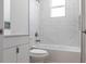 Bright bathroom featuring a bathtub with a shower, a vanity, and modern fixtures at 4880 Cornsilk Ter, North Port, FL 34286