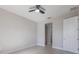 Bright bedroom with white walls, ceiling fan, and hardwood floor at 4880 Cornsilk Ter, North Port, FL 34286
