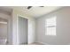 Bedroom with large window, closet, and light-colored flooring at 4880 Cornsilk Ter, North Port, FL 34286