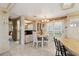 Bright dining area featuring built-in storage, a modern chandelier, and sliding glass doors to the outside at 58 Lakeview Dr, North Port, FL 34287