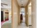 Hallway leading to bedroom and bathroom areas, featuring ample lighting and neutral decor at 58 Lakeview Dr, North Port, FL 34287