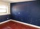 Bedroom with colored walls and hardwood flooring at 7321 Bolten Ln, Port Charlotte, FL 33981
