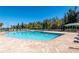 Large community pool with plentiful seating and well-maintained landscaping at 7501 Mikasa Dr, Punta Gorda, FL 33950