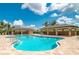 Inviting community pool with lounge chairs and covered seating areas at 7501 Mikasa Dr, Punta Gorda, FL 33950