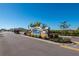 Community entrance featuring a welcoming 'Waterford' sign, lush landscaping, and a secure gate at 7501 Mikasa Dr, Punta Gorda, FL 33950