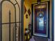 Inviting entryway with a decorated front door, lantern, and decorative wall hangings at 7501 Mikasa Dr, Punta Gorda, FL 33950